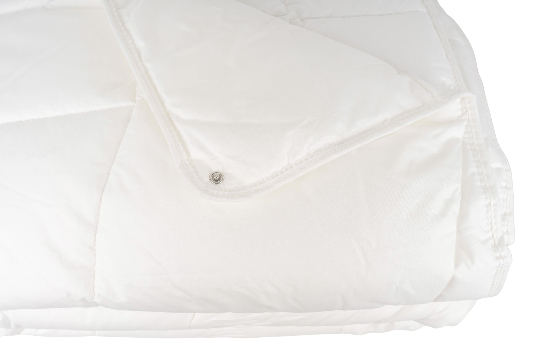 Detailansicht der Druckknöpfe der Annabelle’s Comfort 365 Ganzjahresdecke – flexibel verbindbar für individuellen Wärmebedarf